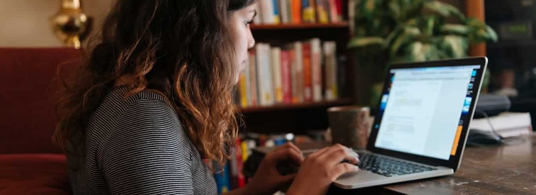 girl on laptop on desk